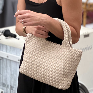 The Mini Edition in cream is the perfect addition to your everyday life while maintaining a chic, luxurious style. With two stylish straps it can be worn several ways, dressed up or down.